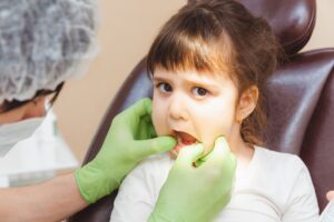 the dentist examines the child s teeth in the dent 2025 03 09 08 51 50 utc
