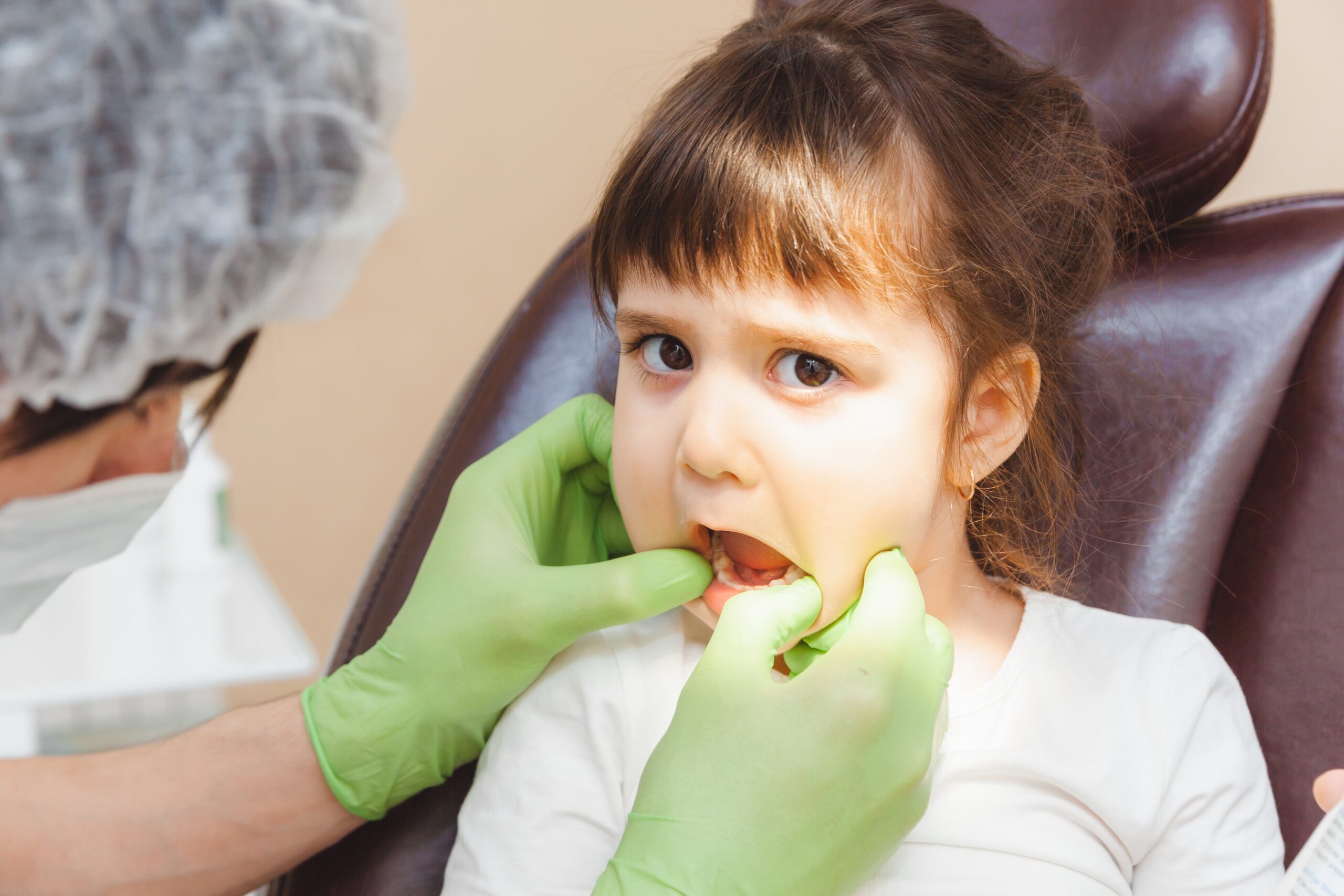 the dentist examines the child s teeth in the dent 2025 03 09 08 51 50 utc
